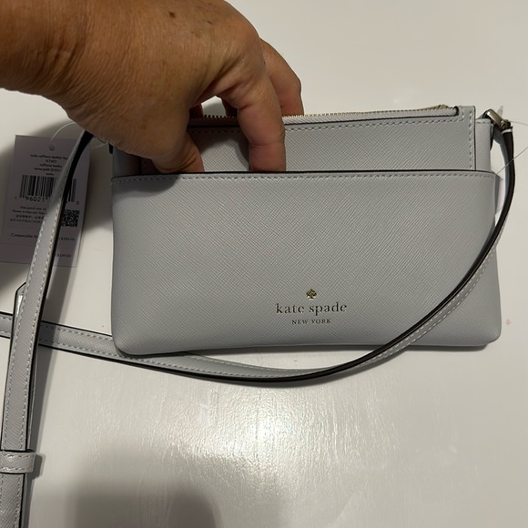 the color is called storm it’s like a light gray color. Wallet as well. - Picture 1 of 4